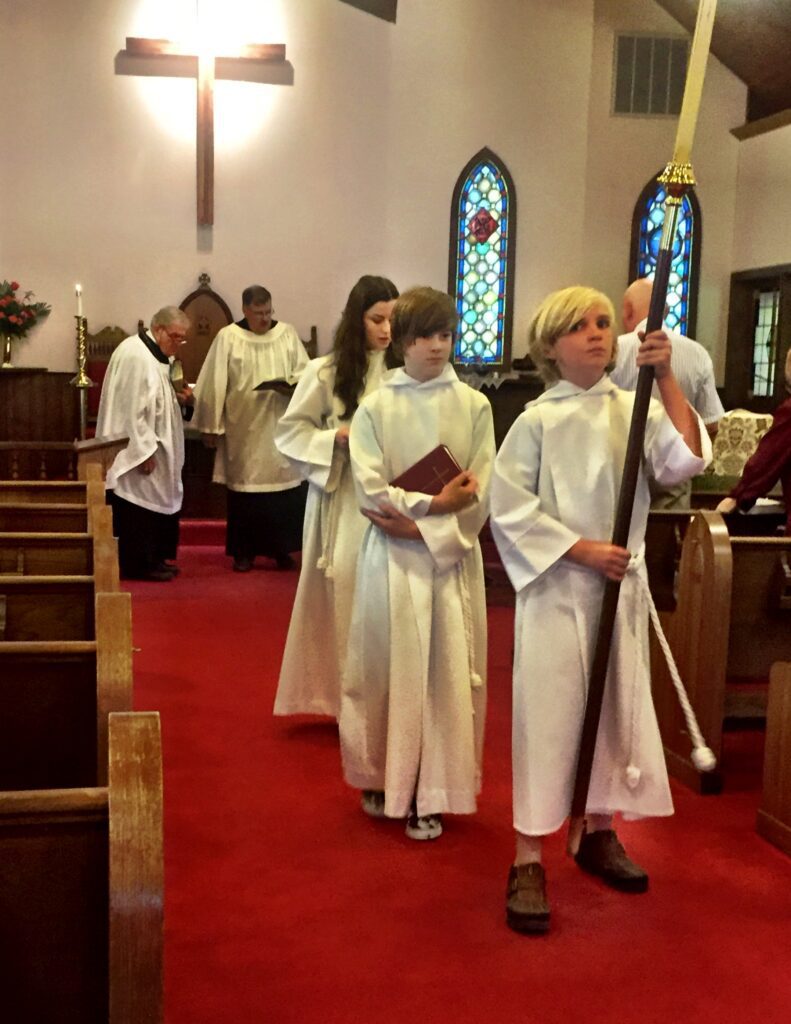 Acolytes leading procession after morning service.